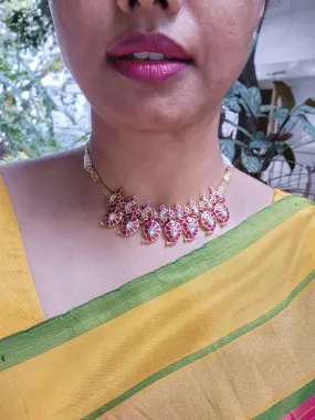 Gold polish kundan & ruby paisley necklace